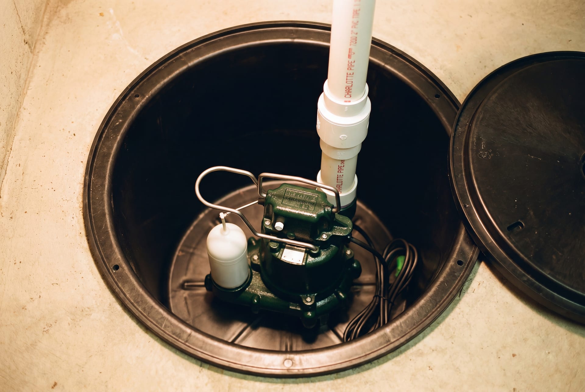 Finished install with labeled pipe runs and clean basin lid